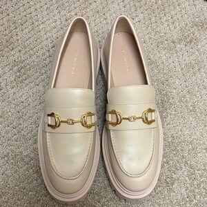 Stuart Weitzman Cream Loafers with Gold Buckles